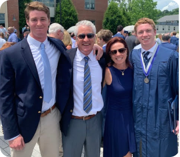 Family of four at graduation